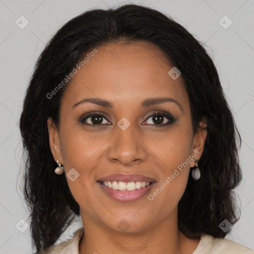 Joyful black young-adult female with long  brown hair and brown eyes