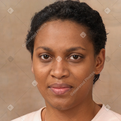 Joyful black adult female with short  brown hair and brown eyes