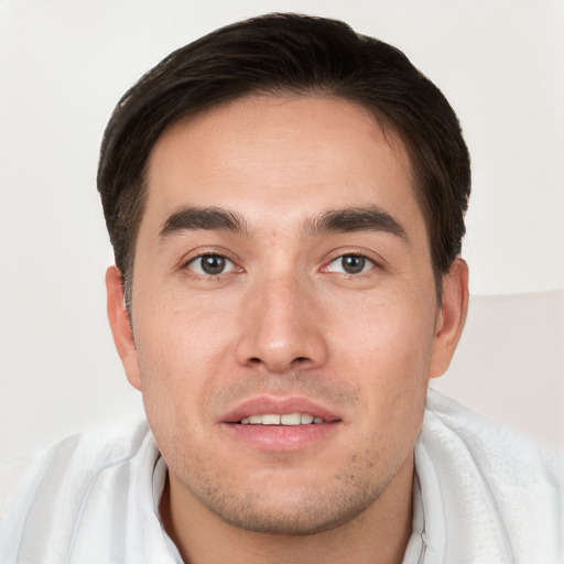 Joyful white young-adult male with short  brown hair and brown eyes