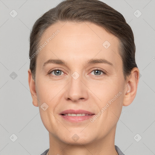 Joyful white adult female with short  brown hair and brown eyes