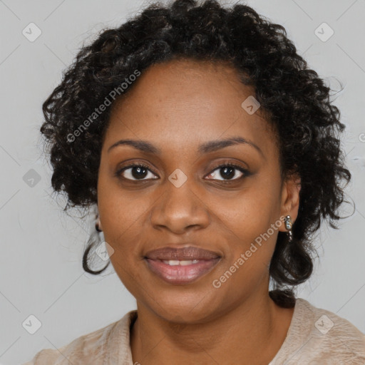 Joyful black young-adult female with long  black hair and brown eyes