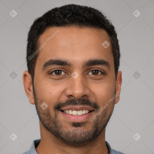 Joyful latino young-adult male with short  black hair and brown eyes