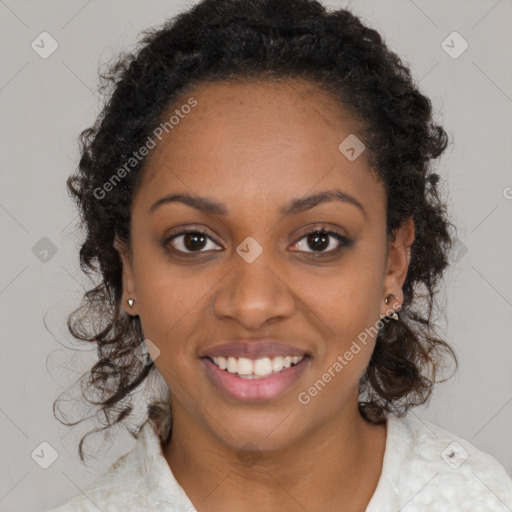 Joyful black young-adult female with long  brown hair and brown eyes