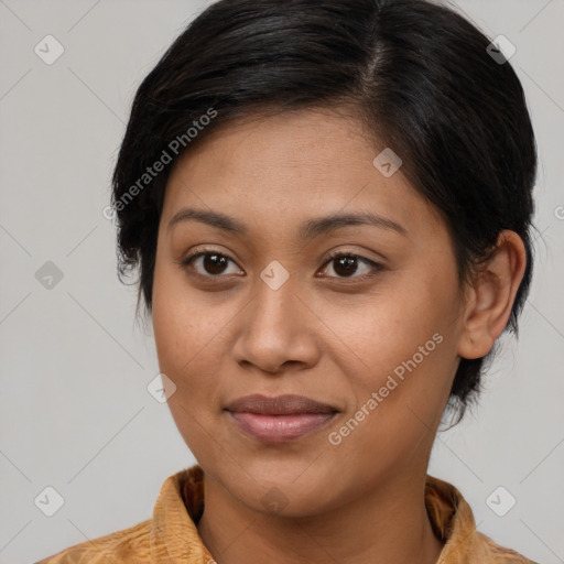 Joyful latino young-adult female with medium  brown hair and brown eyes