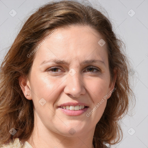 Joyful white adult female with medium  brown hair and blue eyes