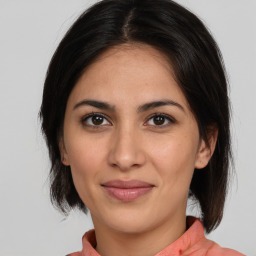 Joyful white young-adult female with medium  brown hair and brown eyes