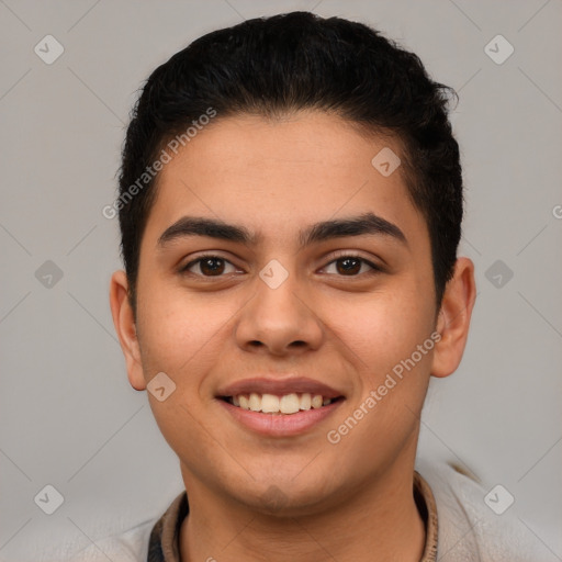 Joyful latino young-adult male with short  brown hair and brown eyes