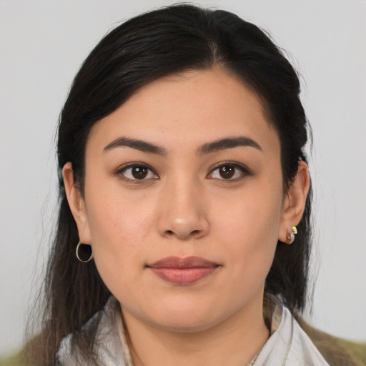 Joyful latino young-adult female with medium  brown hair and brown eyes