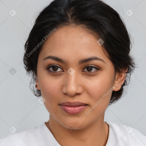 Joyful latino young-adult female with medium  brown hair and brown eyes