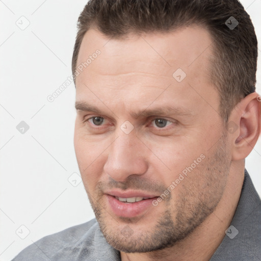 Joyful white adult male with short  brown hair and brown eyes