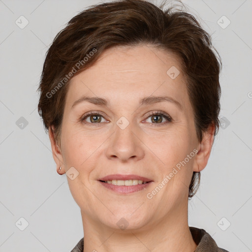 Joyful white adult female with short  brown hair and grey eyes