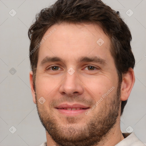 Joyful white adult male with short  brown hair and brown eyes