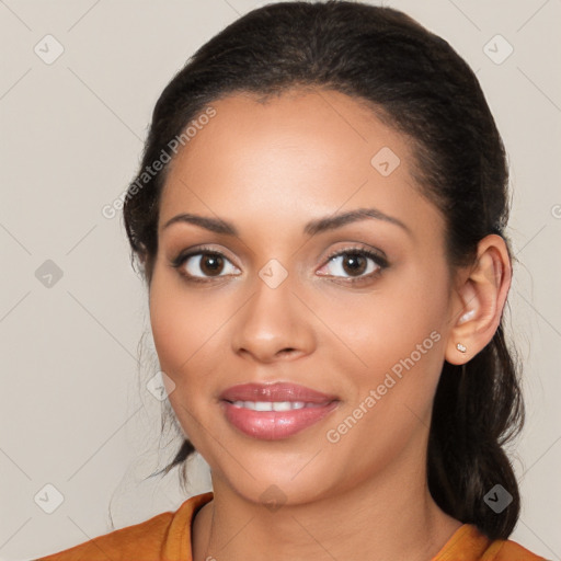 Joyful latino young-adult female with medium  brown hair and brown eyes