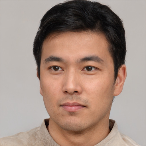 Neutral asian young-adult male with short  black hair and brown eyes