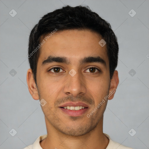 Joyful white young-adult male with short  black hair and brown eyes