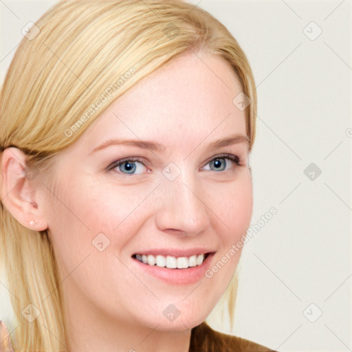 Joyful white young-adult female with long  brown hair and blue eyes