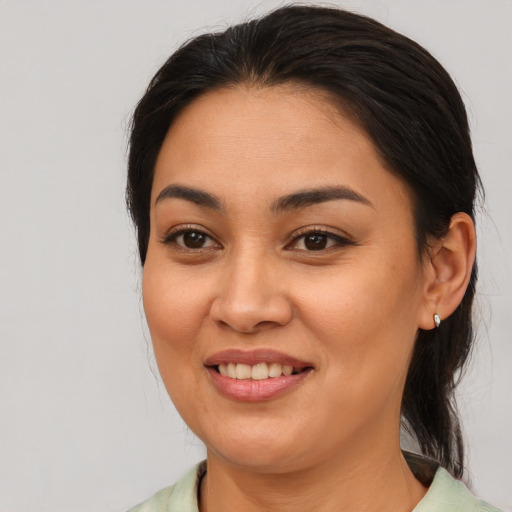 Joyful asian young-adult female with medium  brown hair and brown eyes