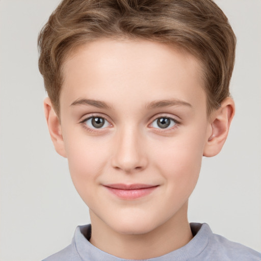 Joyful white child female with short  brown hair and grey eyes