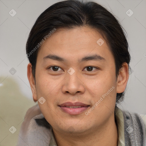 Joyful asian young-adult male with short  brown hair and brown eyes