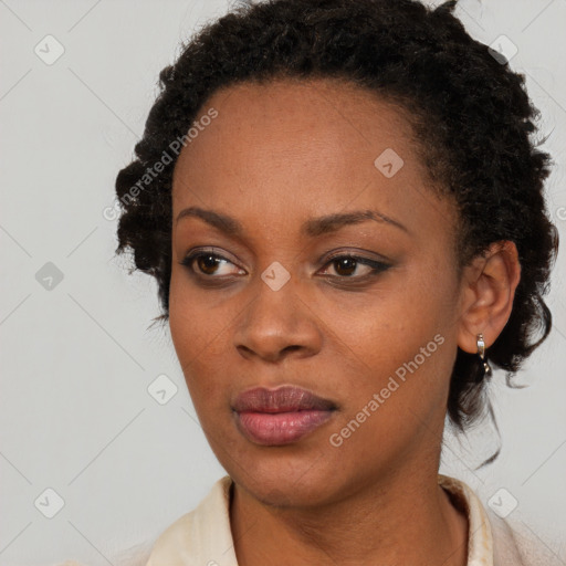 Neutral black young-adult female with short  brown hair and brown eyes