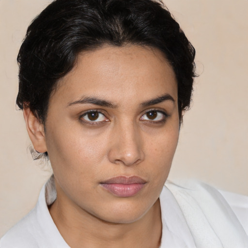 Neutral white young-adult female with short  brown hair and brown eyes