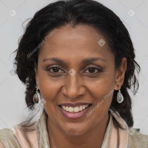 Joyful latino adult female with medium  brown hair and brown eyes