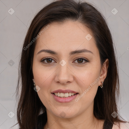 Joyful white young-adult female with long  brown hair and brown eyes