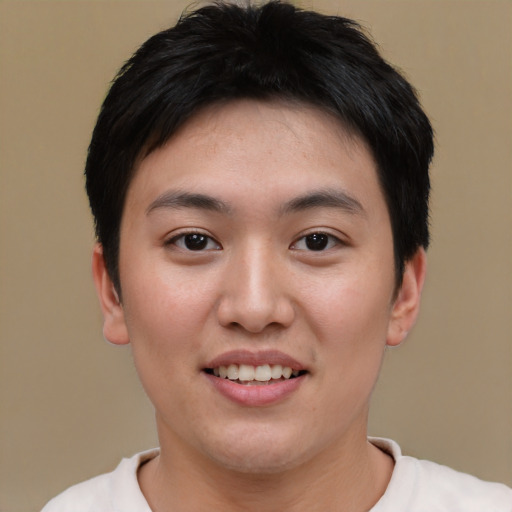 Joyful asian young-adult female with short  black hair and brown eyes