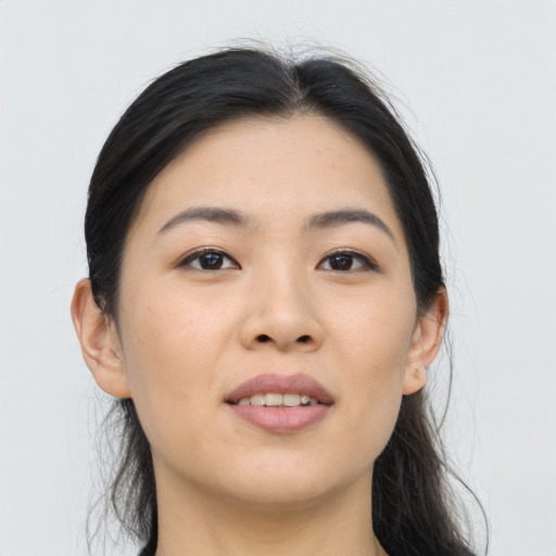 Joyful asian young-adult female with medium  brown hair and brown eyes