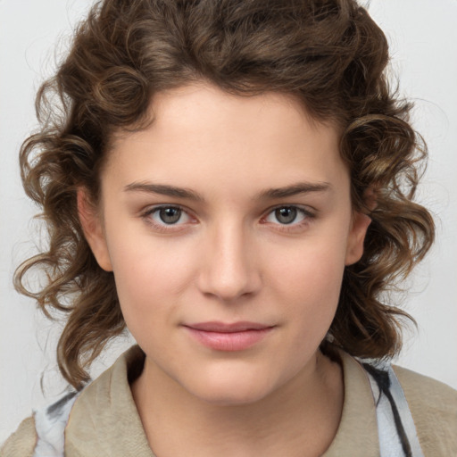 Joyful white child female with medium  brown hair and brown eyes