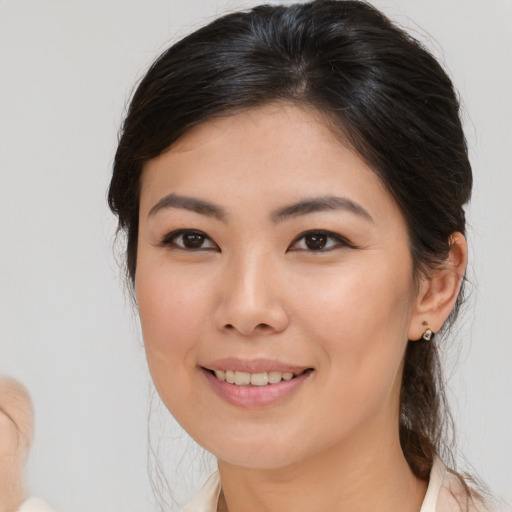 Joyful white young-adult female with medium  brown hair and brown eyes