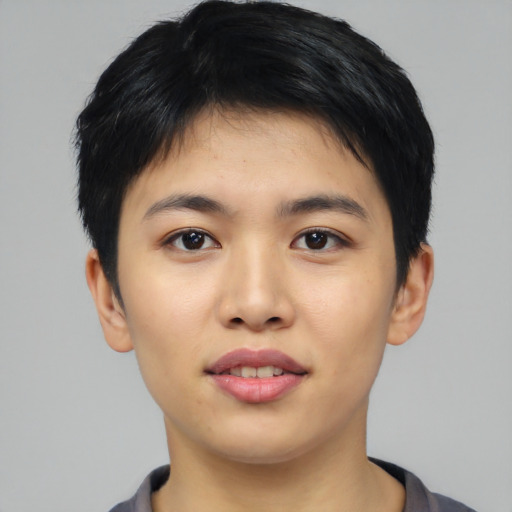 Joyful asian young-adult male with short  black hair and brown eyes