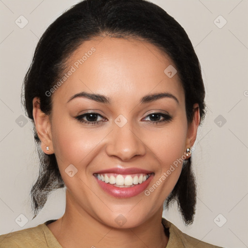 Joyful latino young-adult female with medium  brown hair and brown eyes