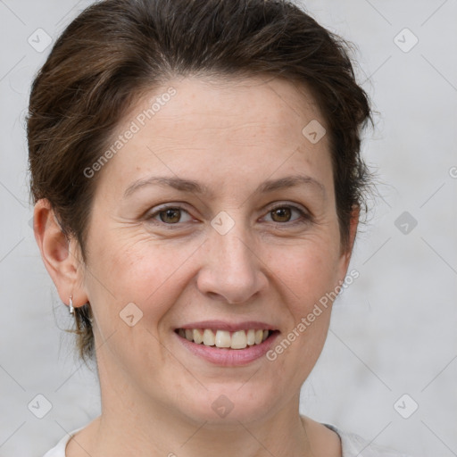 Joyful white adult female with short  brown hair and brown eyes