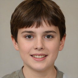 Joyful white child male with short  brown hair and brown eyes