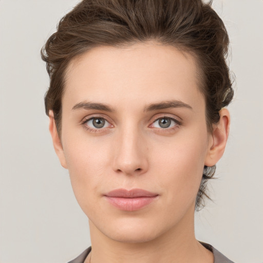 Neutral white young-adult female with short  brown hair and brown eyes