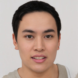 Joyful asian young-adult male with short  black hair and brown eyes