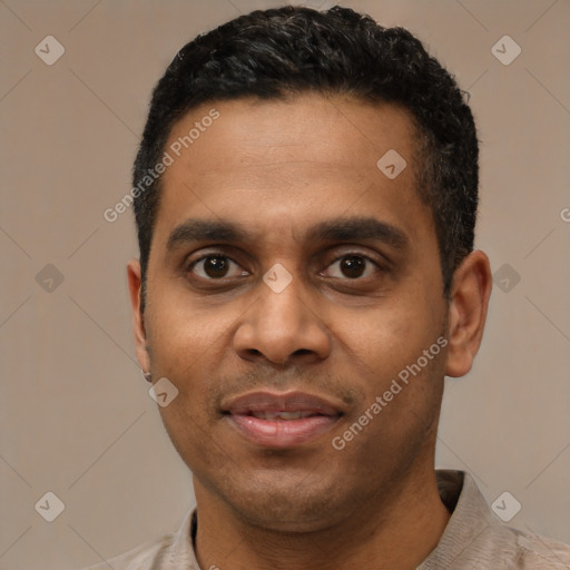 Joyful latino young-adult male with short  black hair and brown eyes
