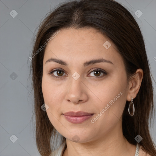 Joyful white young-adult female with long  brown hair and brown eyes