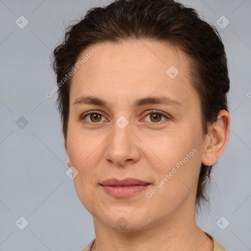 Joyful white adult female with medium  brown hair and brown eyes