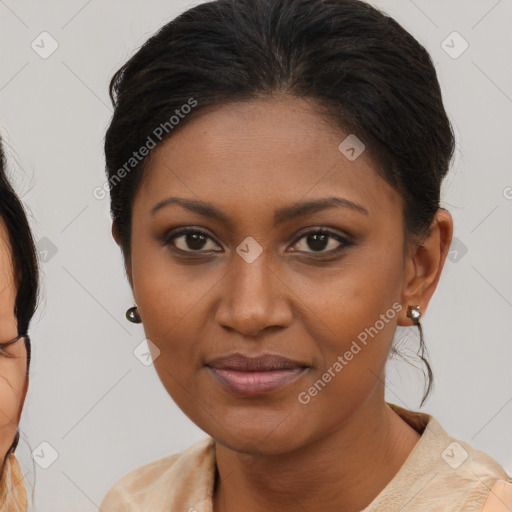 Joyful black young-adult female with medium  brown hair and brown eyes