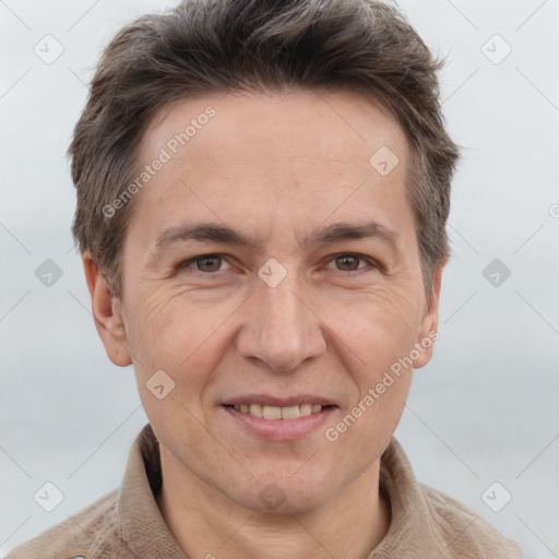 Joyful white adult male with short  brown hair and grey eyes