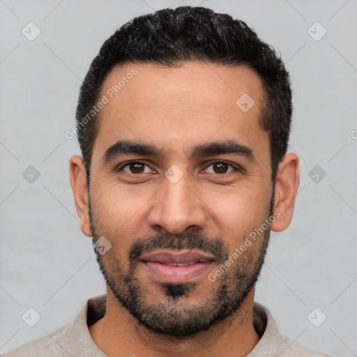 Joyful latino young-adult male with short  black hair and brown eyes