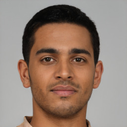 Neutral latino young-adult male with short  black hair and brown eyes