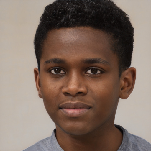 Joyful black young-adult male with short  brown hair and brown eyes