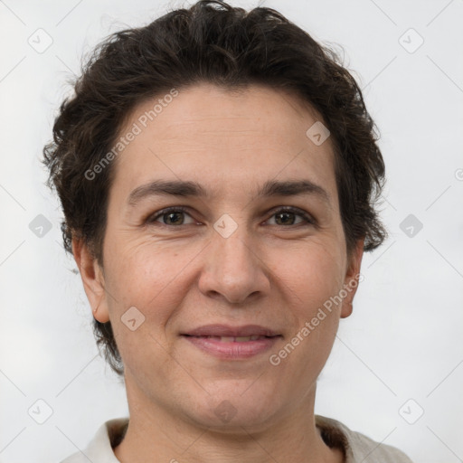 Joyful white adult female with short  brown hair and brown eyes