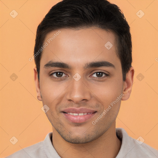 Joyful latino young-adult male with short  brown hair and brown eyes