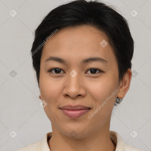 Joyful asian young-adult female with short  brown hair and brown eyes