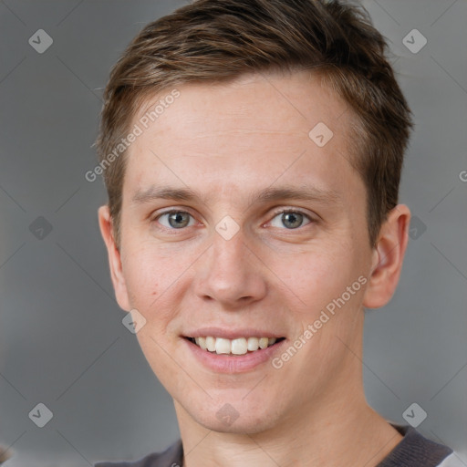 Joyful white adult male with short  brown hair and grey eyes