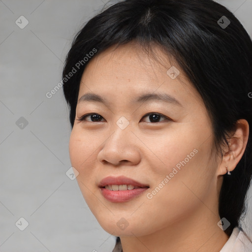 Joyful asian young-adult female with medium  black hair and brown eyes